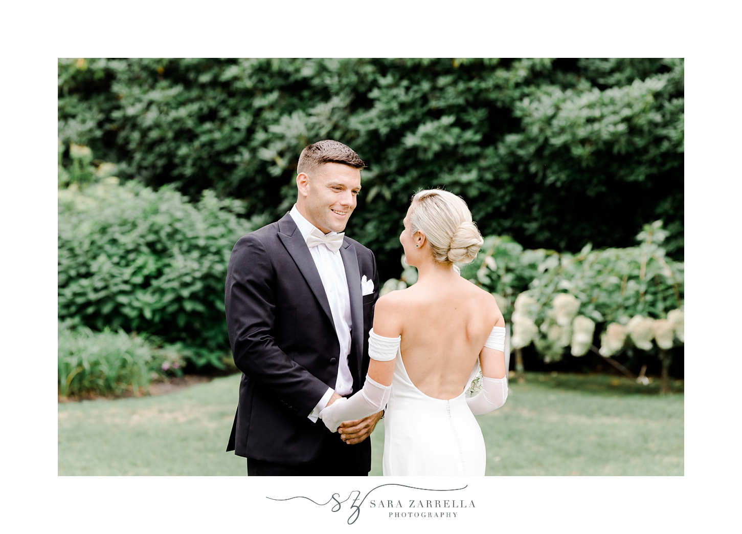 groom grins at bride during first look at Glen Manor House