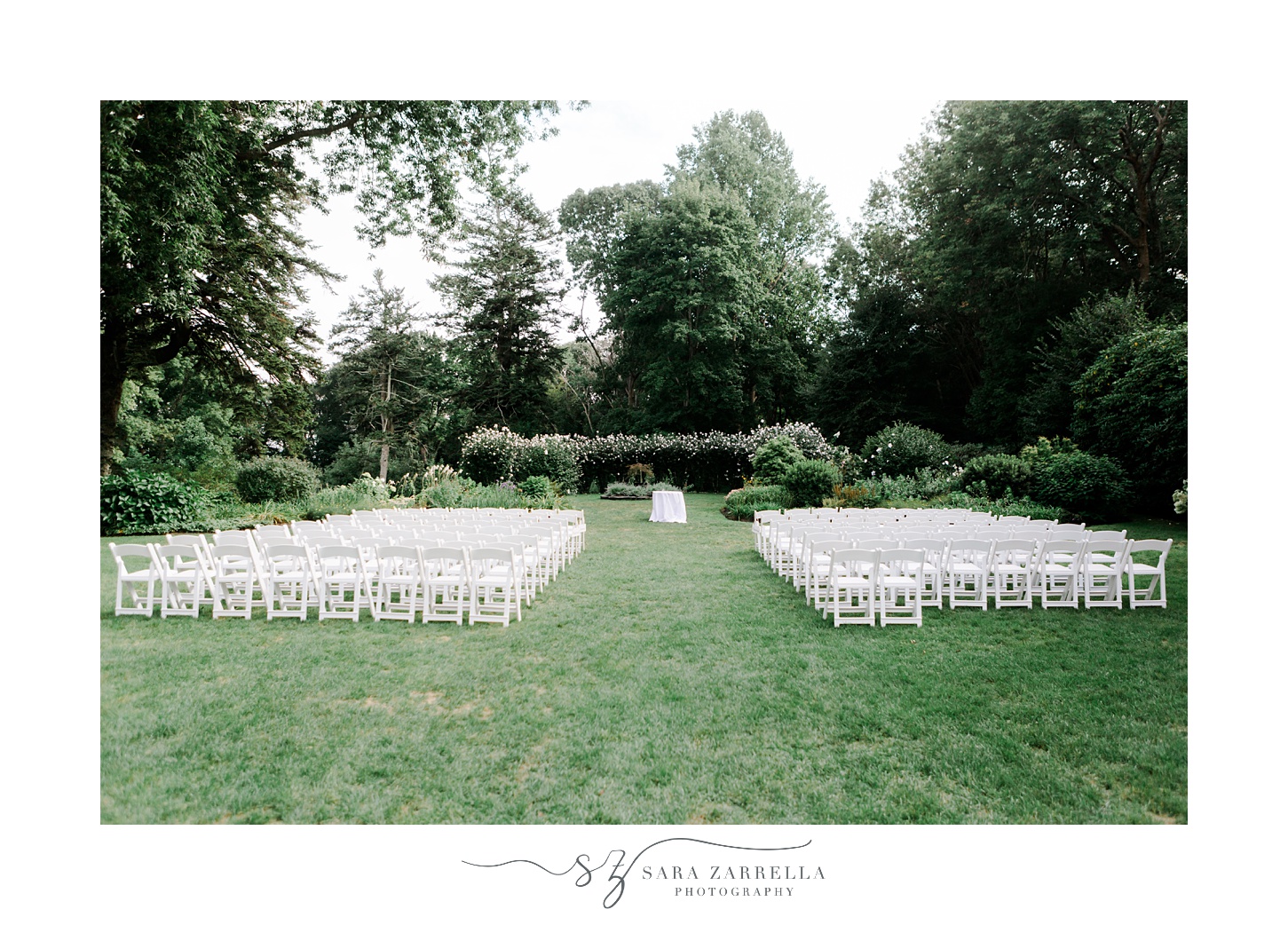 wedding ceremony on lawn at Glen Manor House with white chairs 