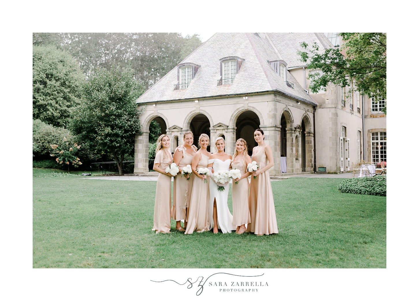 bride and bridesmaids in champagne gowns pose outside Glen Manor House