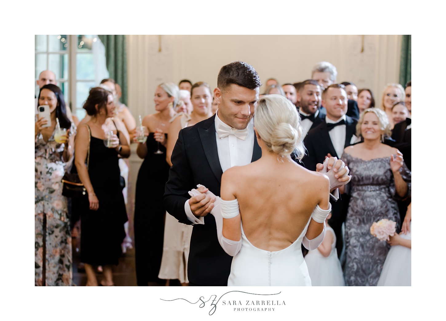 bride and groom dance together at Portsmouth RI wedding recption