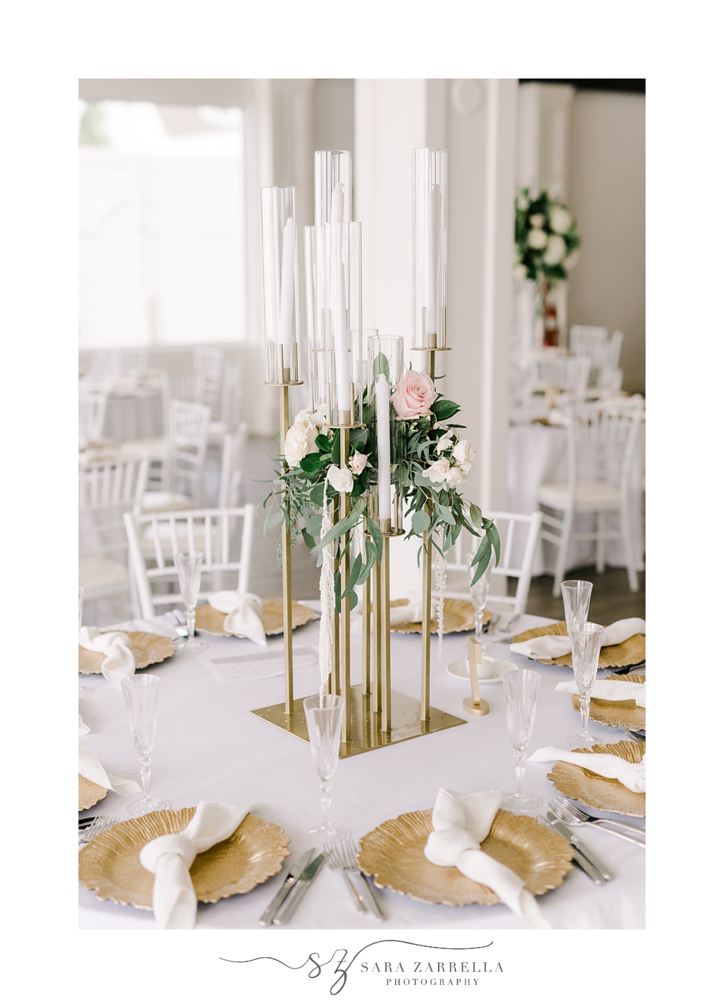 summer wedding reception at Belle Mer Island House with candles and gold chargers 