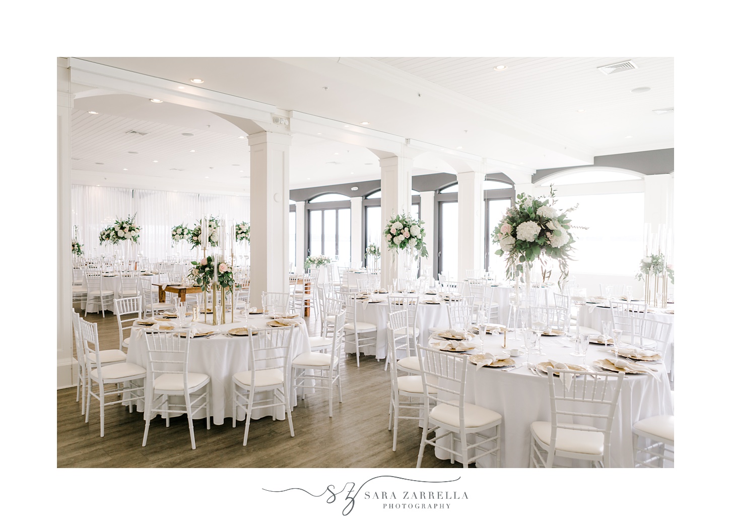 summer wedding reception at Belle Mer Island House with pink and white flowers 