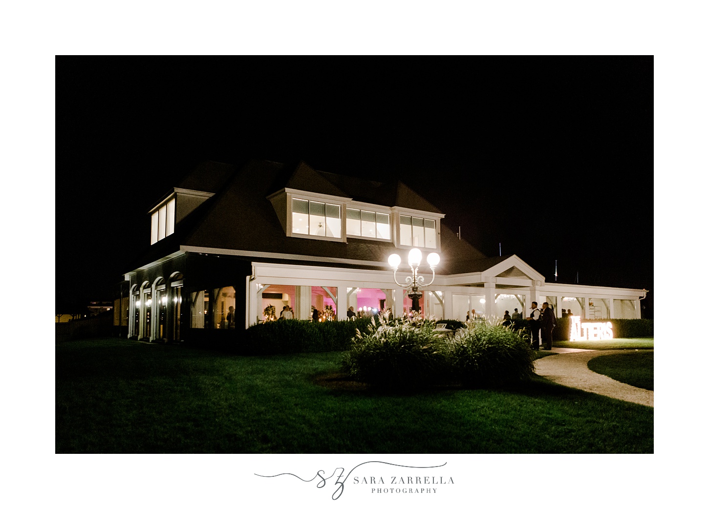 nighttime photo of Belle Mer Island House lit up 