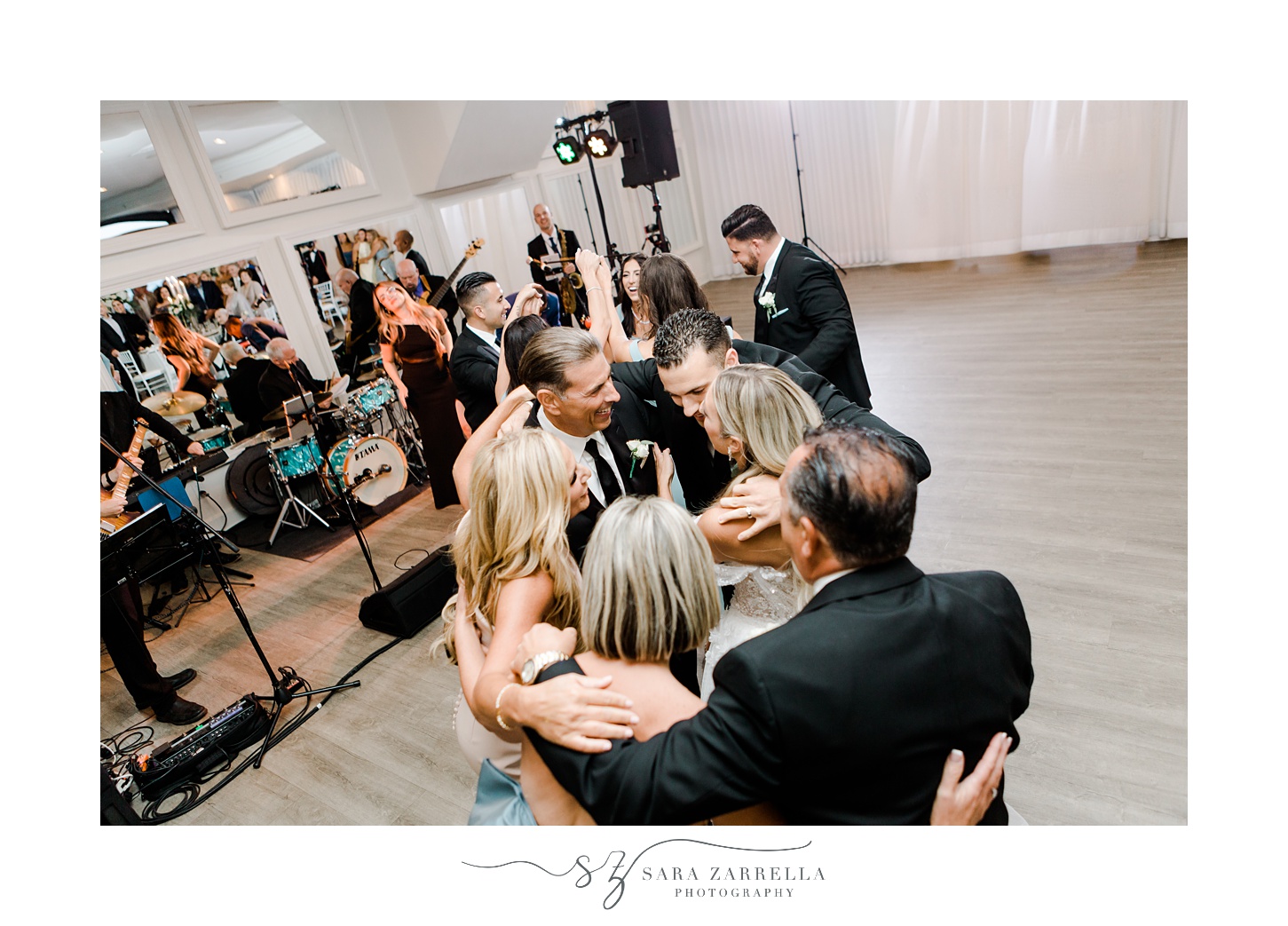 newlyweds dance hugging family at Newport RI wedding reception 