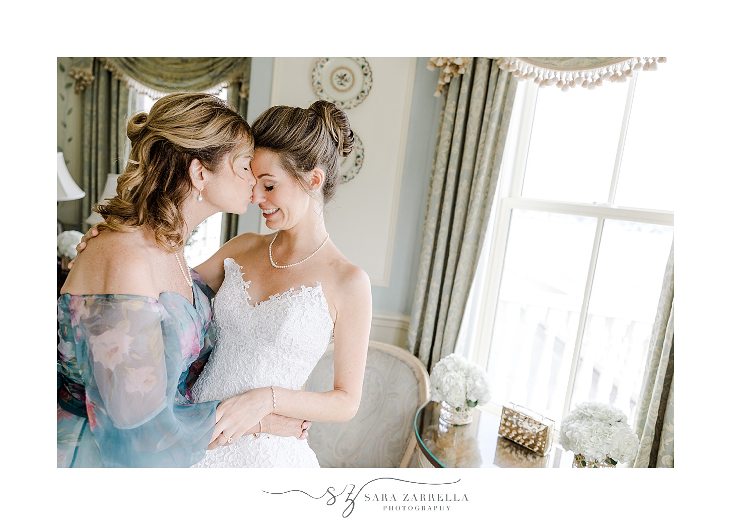 mom kisses bride's forehead the bridal suite at the Chanler