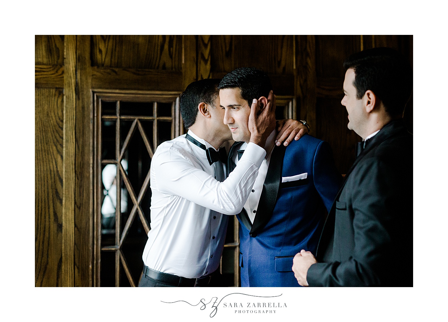 brother kisses groom's cheek during prep at the Chanler