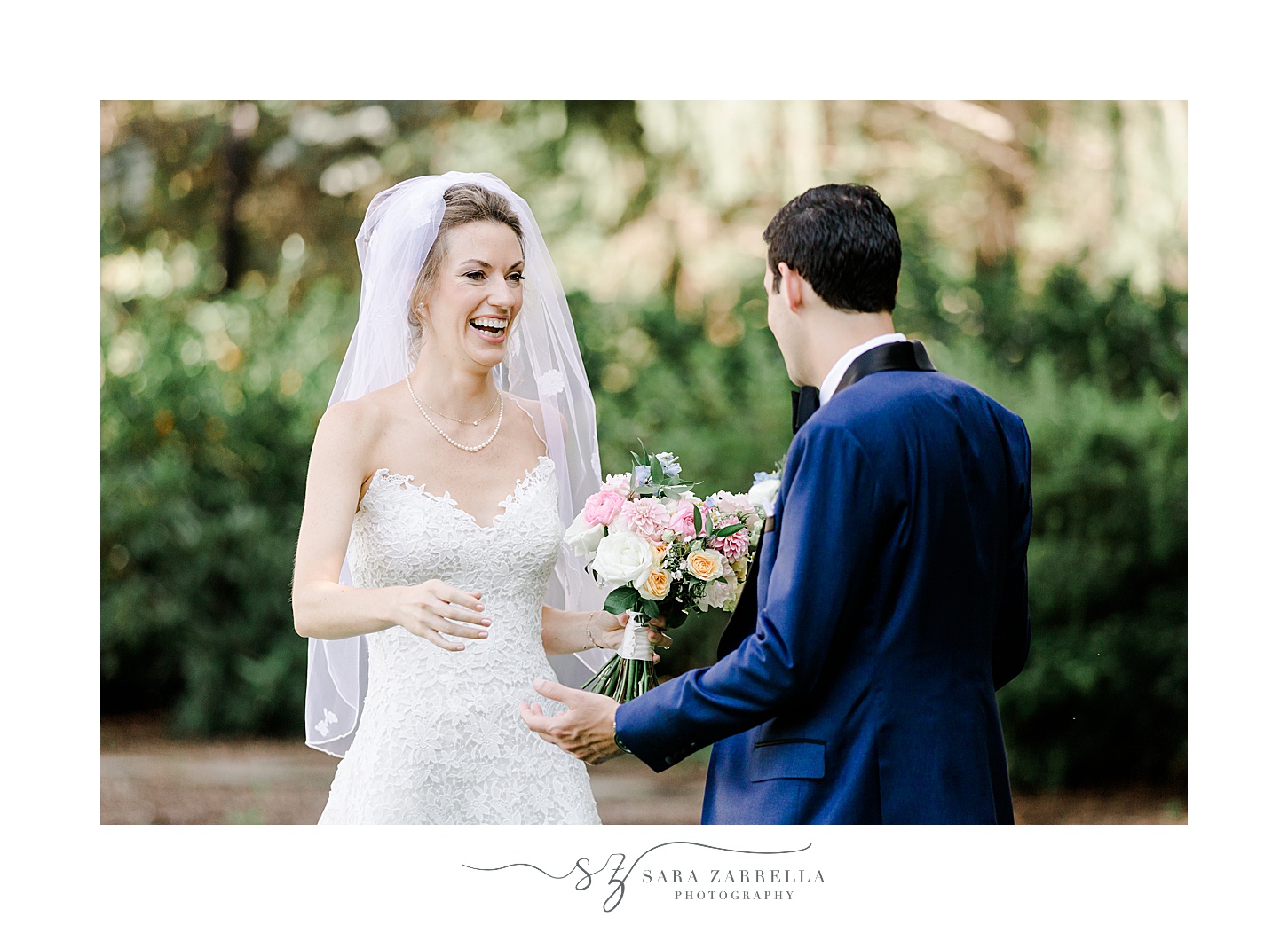 bride and groom smile during first look seeing each other for the first time 