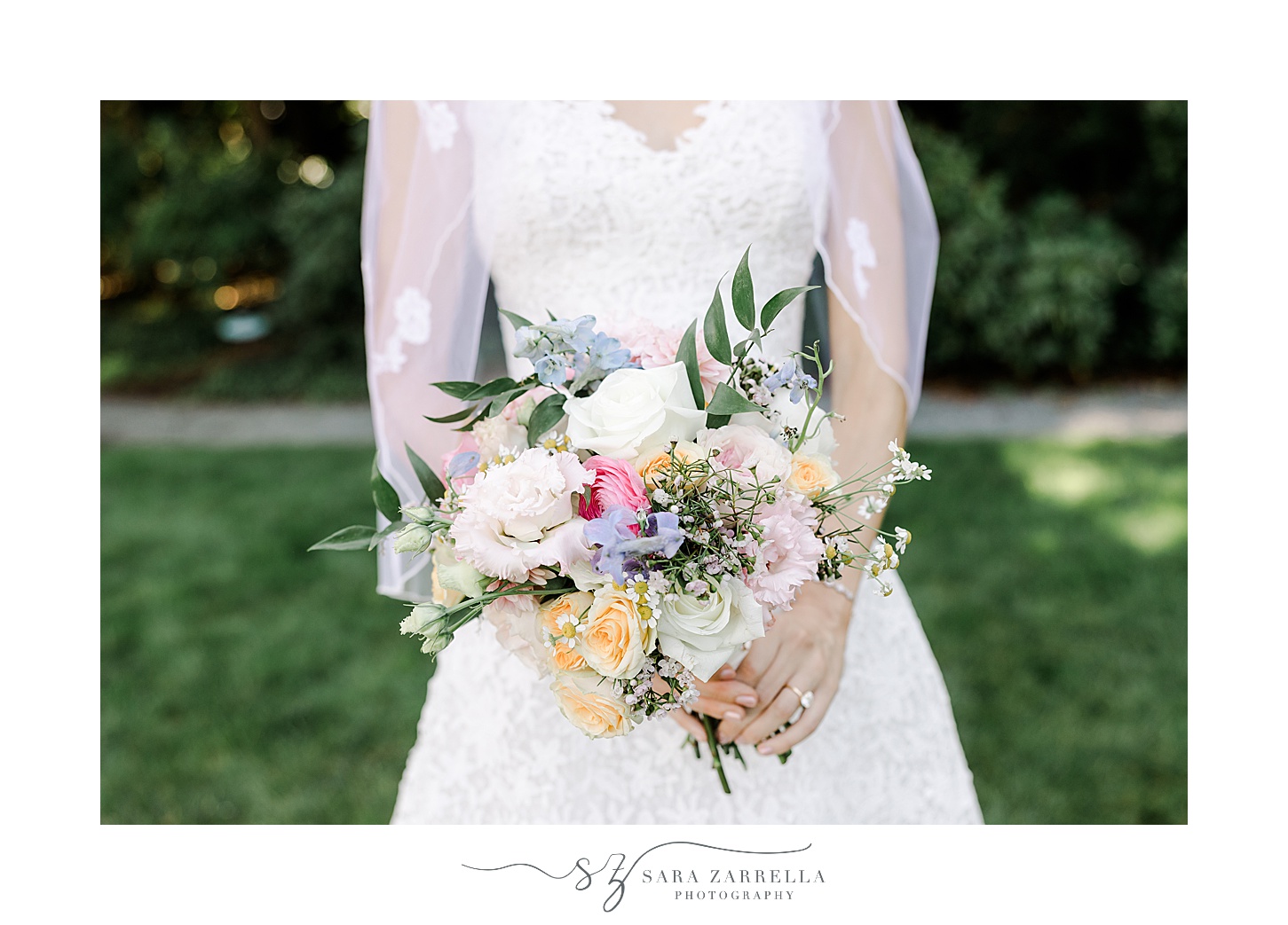 bride holds bouquet of pink, orange, and white flowers for summer wedding at the Chanler