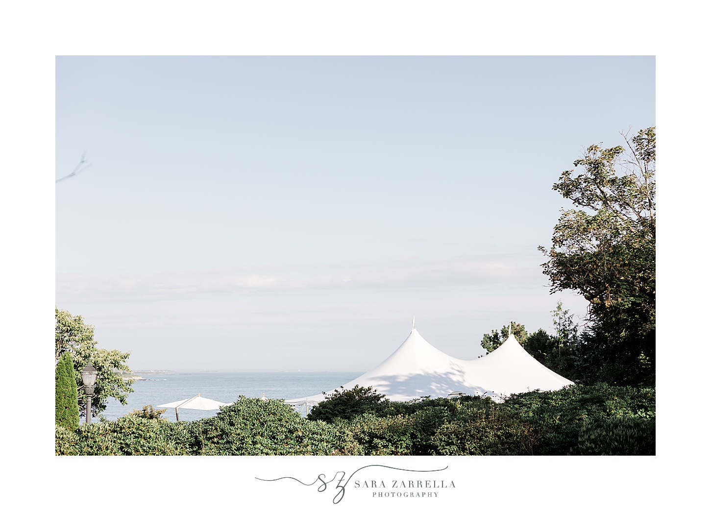 top of white tent overlooking water at the Chanler
