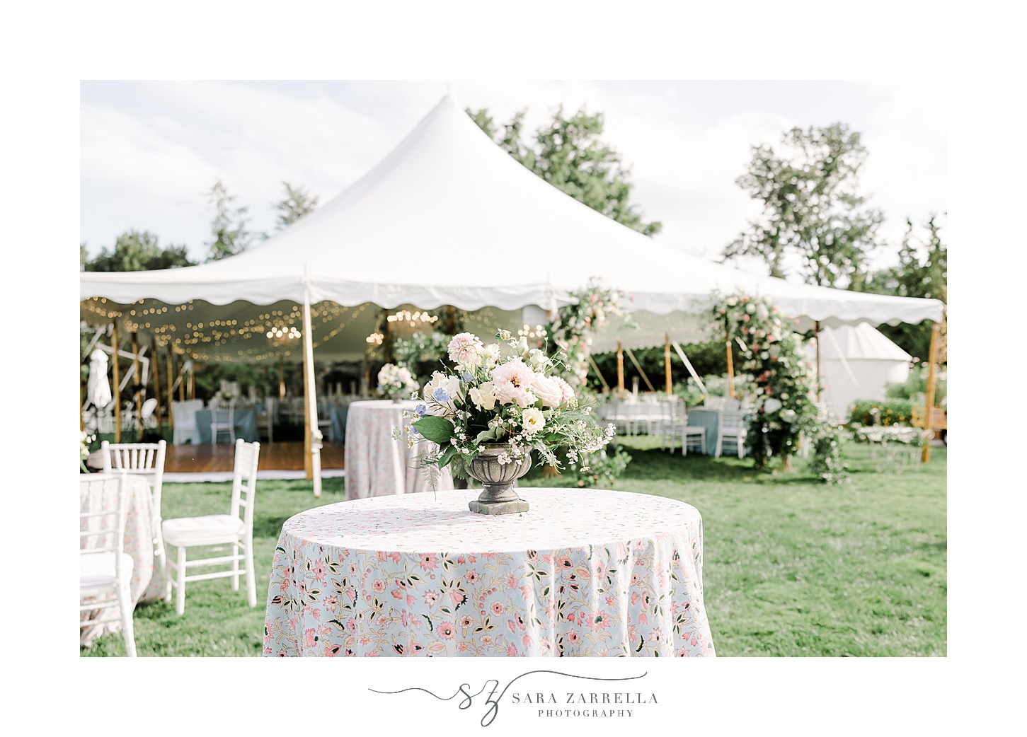 cocktail hour tables with pink table cloths and white florals 