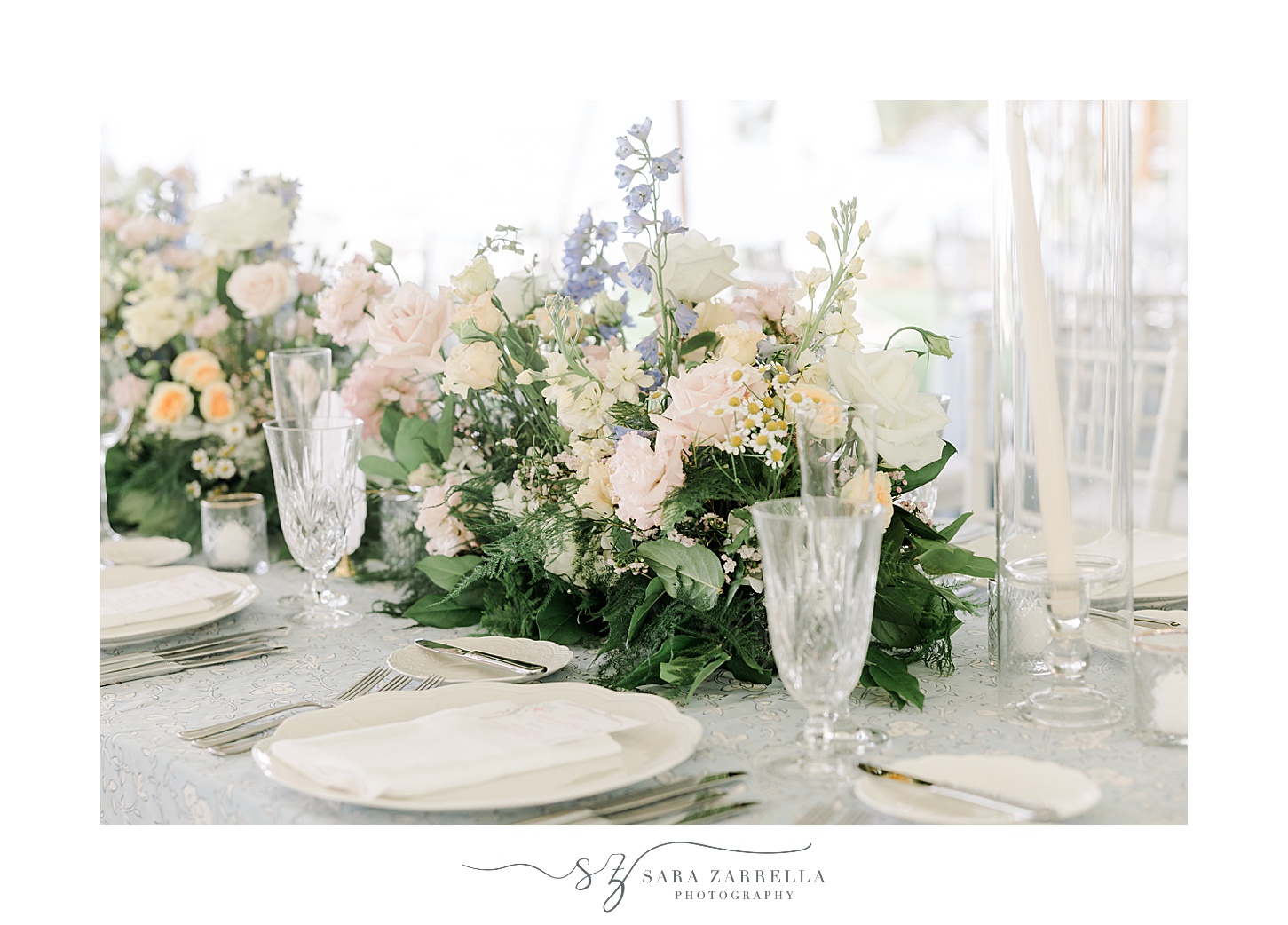 wedding reception with vintage glasses and pastel flower centerpieces at the Chanler
