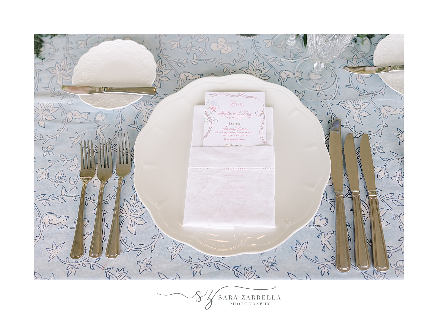 place setting with white plates on blue table cloth at the Chanler