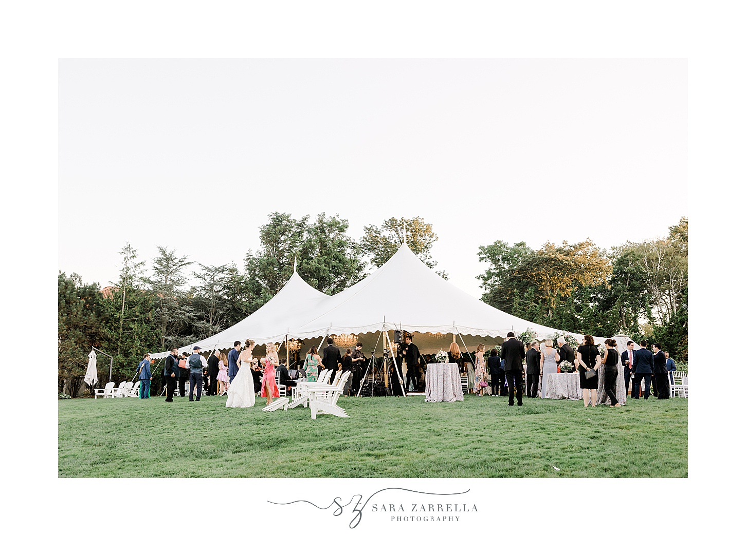 guests mingle around white tent at the Chanler