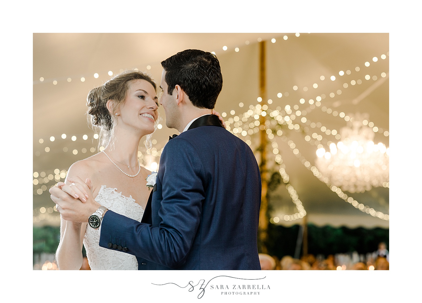 newlyweds dance under tent with fairy lights at the Chanler in Newport RI