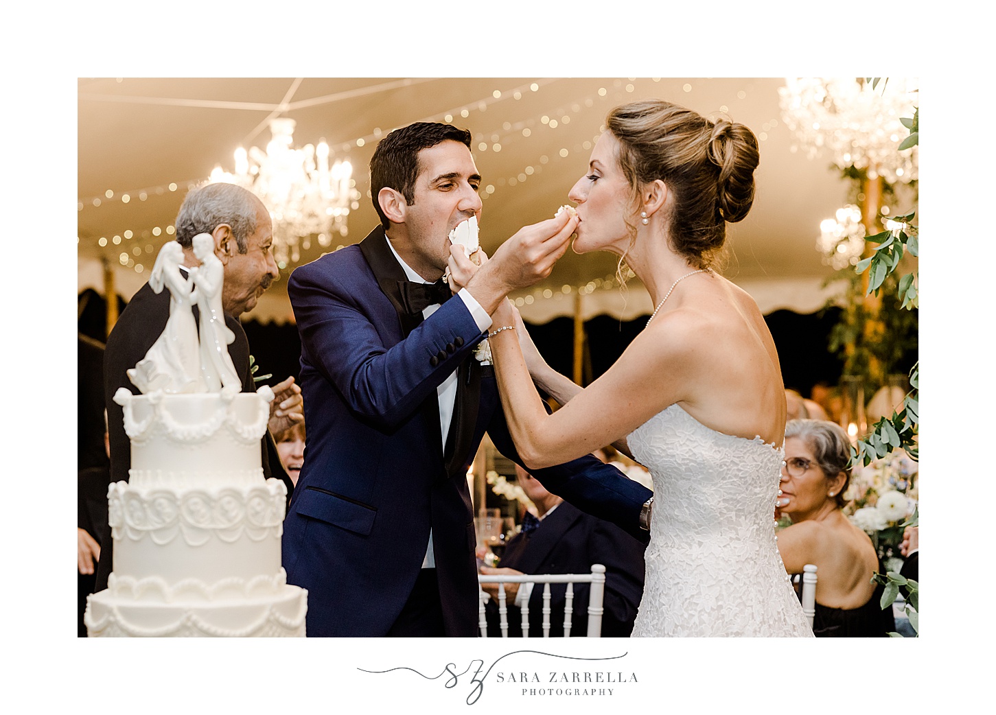 bride and groom cut wedding cake during reception at the Chanler