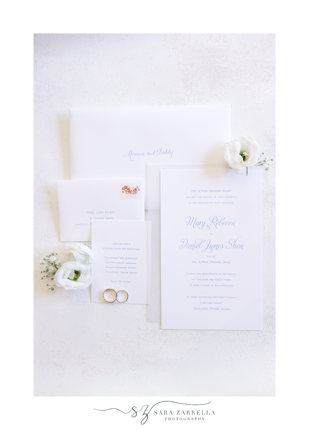 wedding stationery with blue lettering on ivory paper 