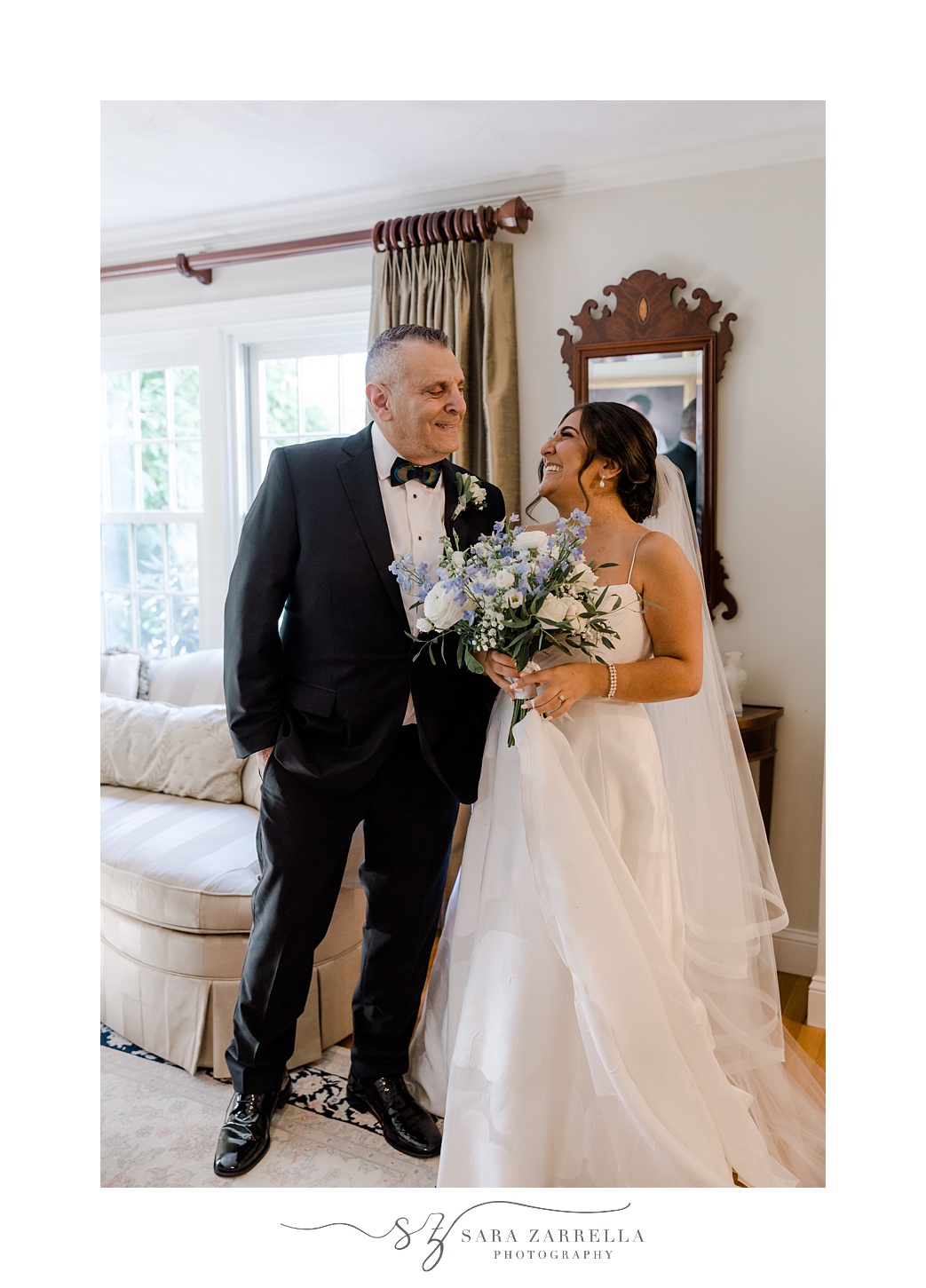 bride and father hug in living room of RI home 