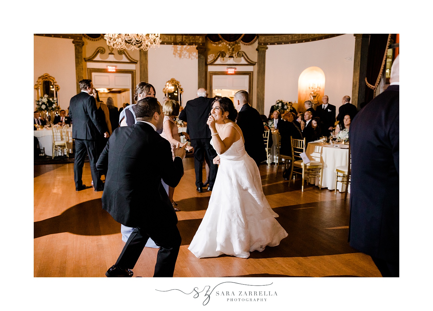 bride and groom dance with guests during Providence RI wedding reception