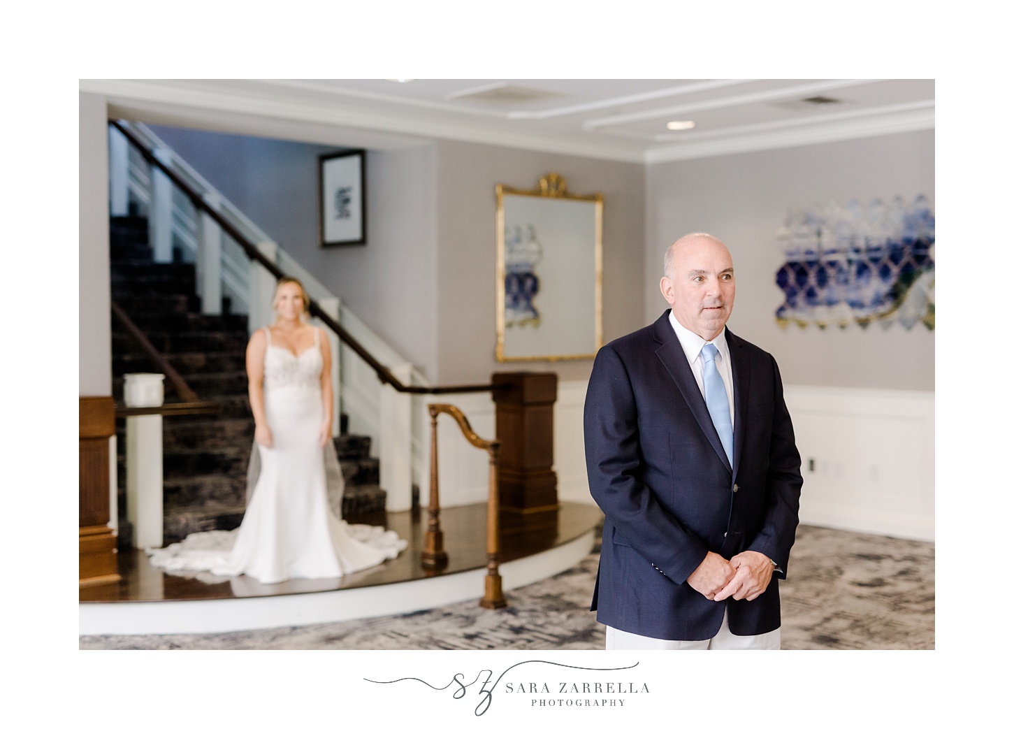 bride approaches father for first look in lobby at Regatta Place