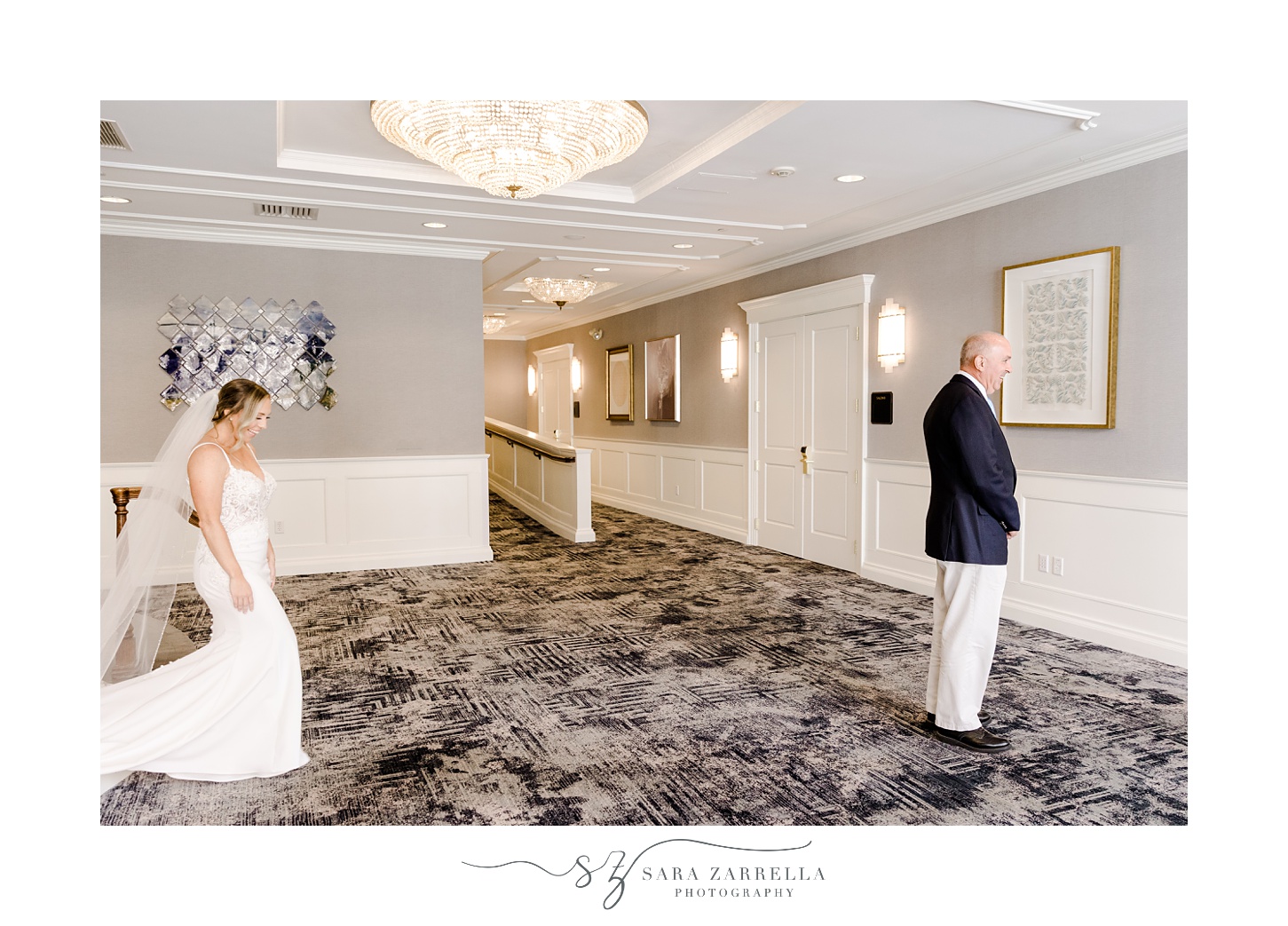 bride walks to father for first look in lobby of Regatta Place