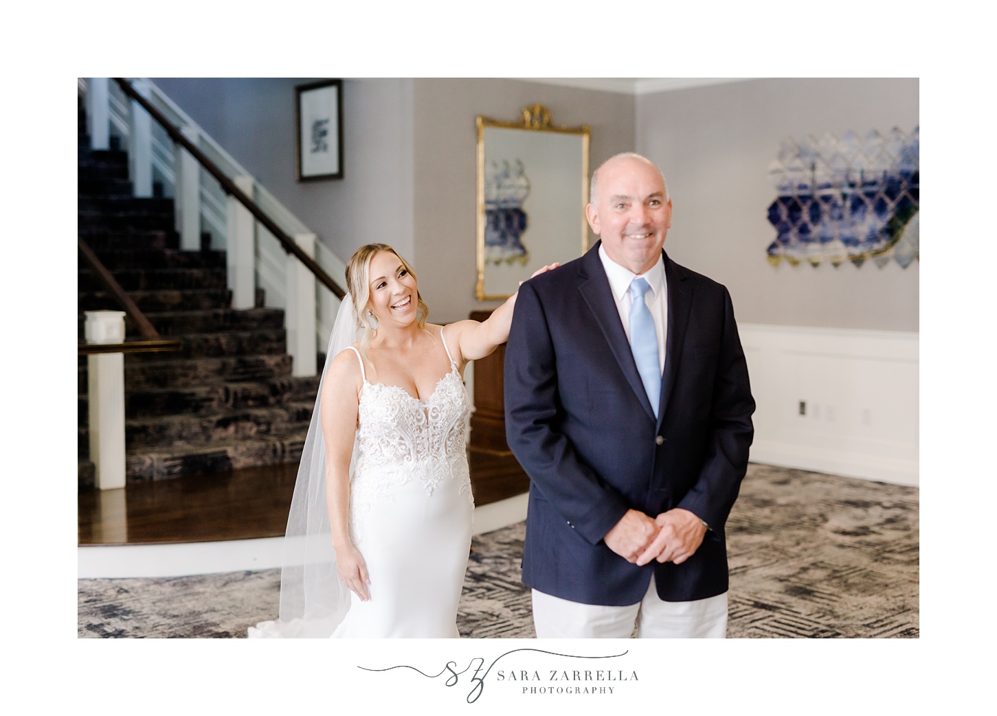 bride taps father for first look in lobby of Regatta Place