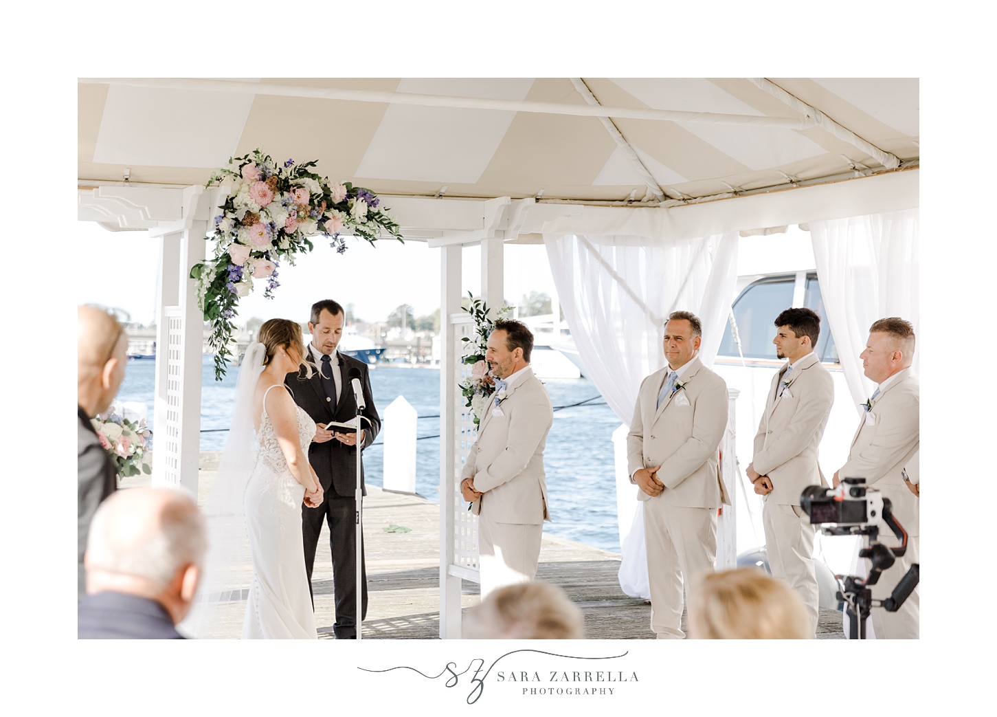 bride and groom read vows during waterfront wedding ceremony at Regatta Place