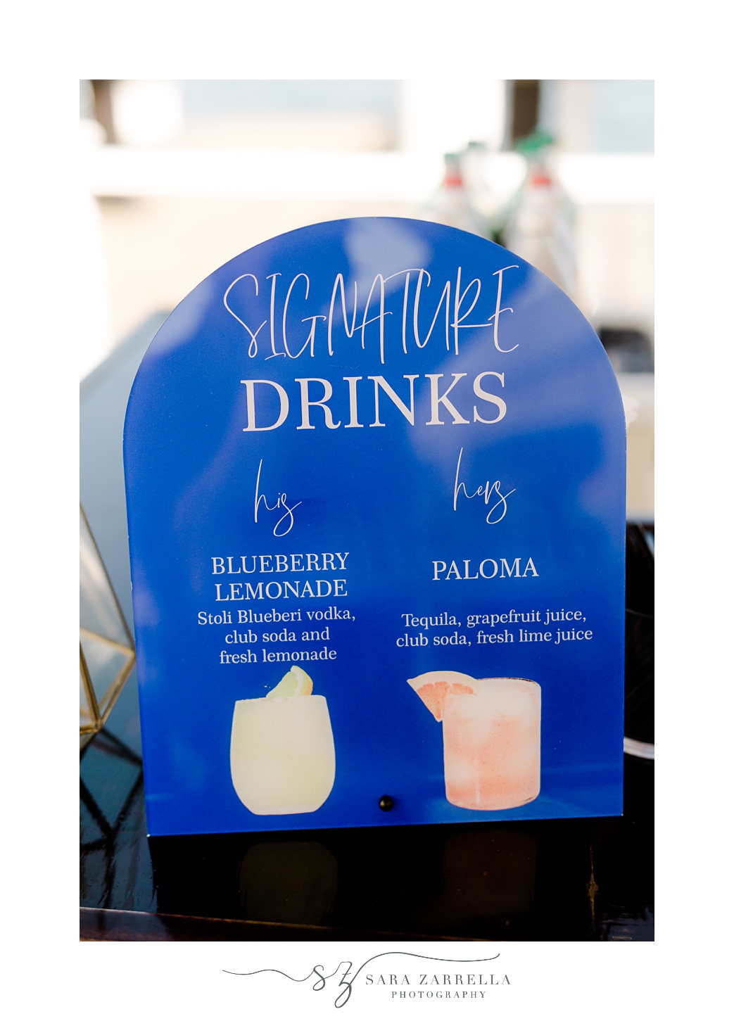 signature drinks on blue acrylic sign at Regatta Place