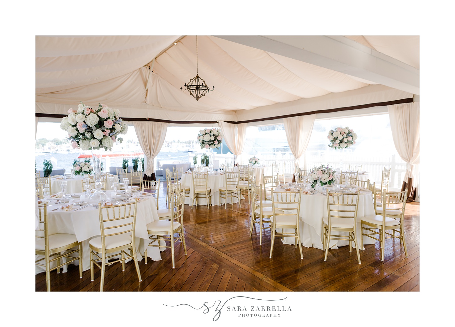 tented wedding reception at Regatta Place with pink and white flowers 