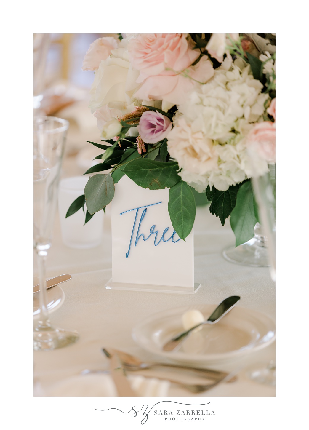 table number with blue script for summer reception at Regatta Place