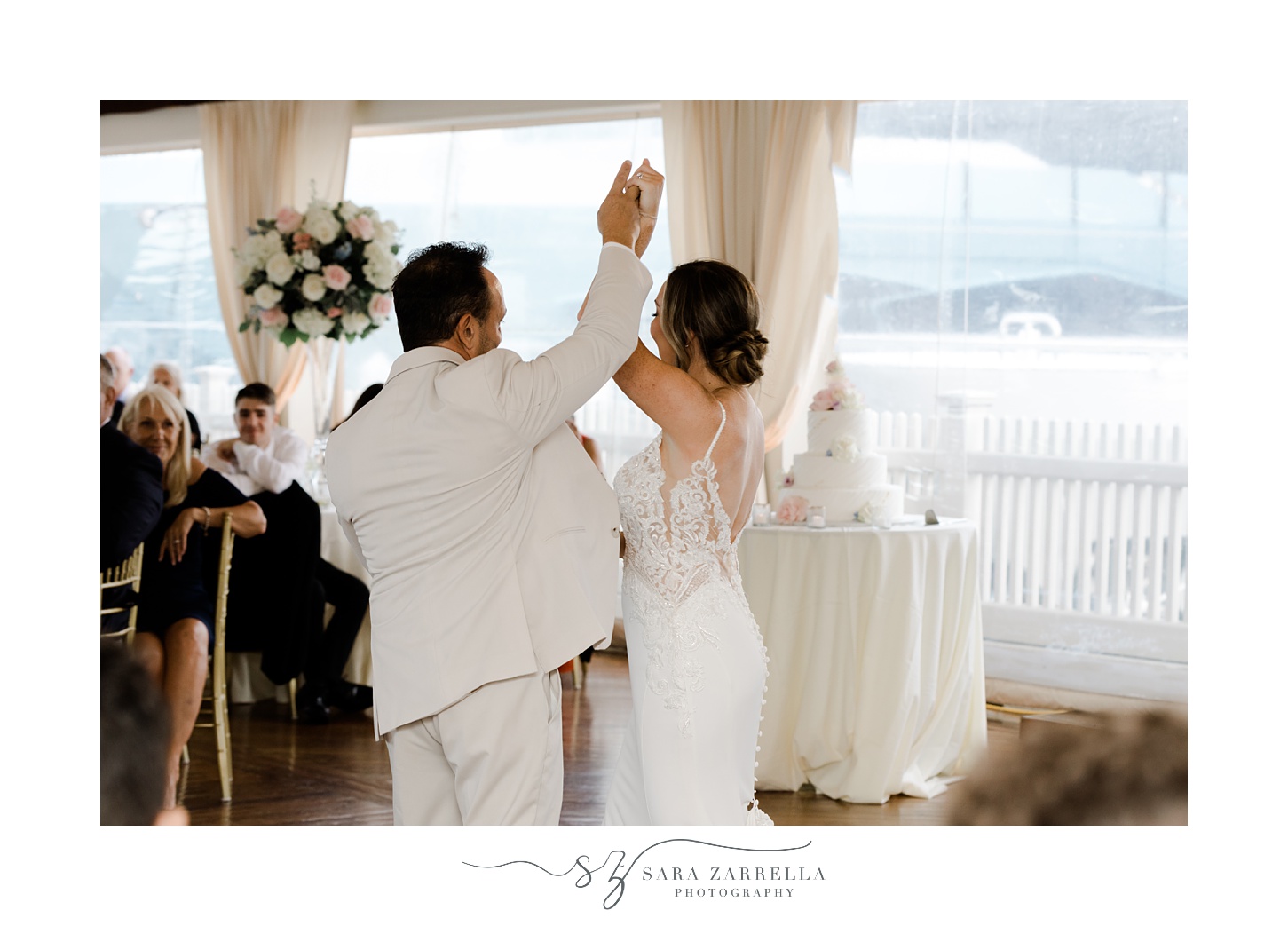 groom twirls bride during Newport RI wedding reception