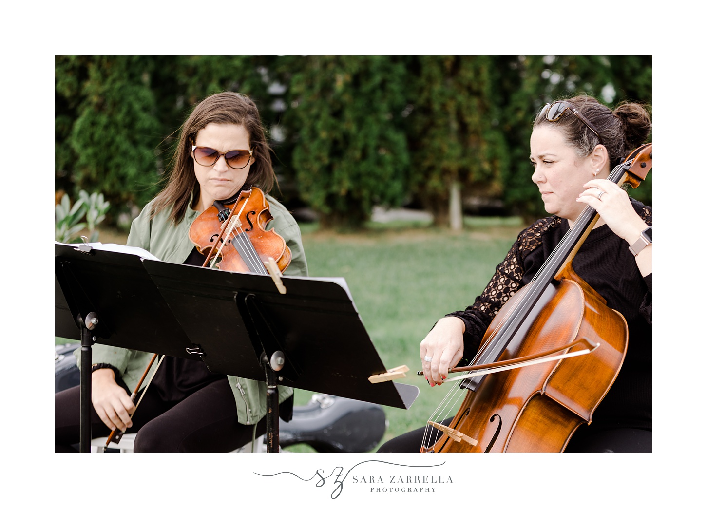strings duo performs during outdoor wedding ceremony at the Atlantic Wyndham Resort
