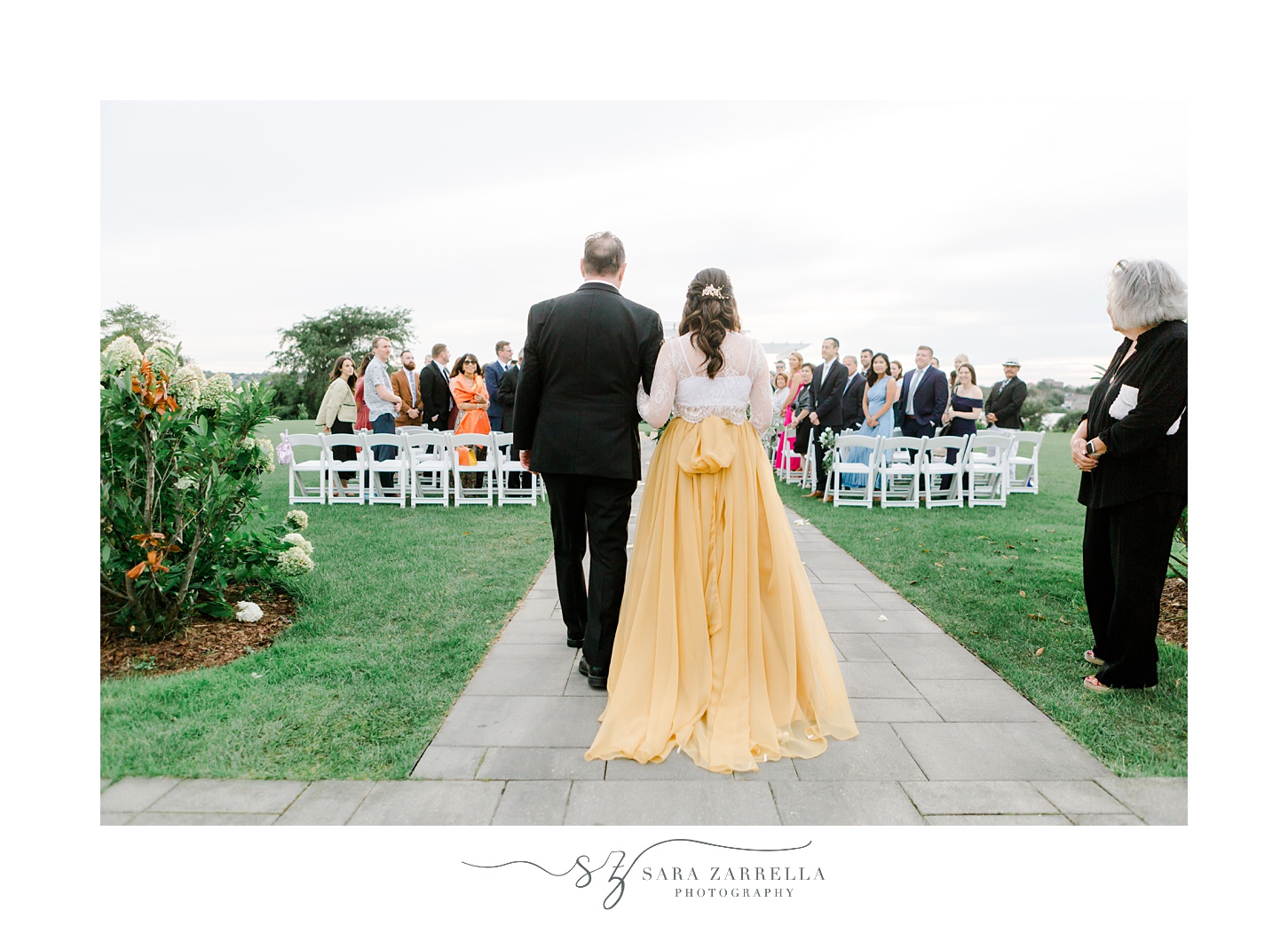 bride escorted down aisle by father for outdoor wedding ceremony at the Atlantic Wyndham Resort