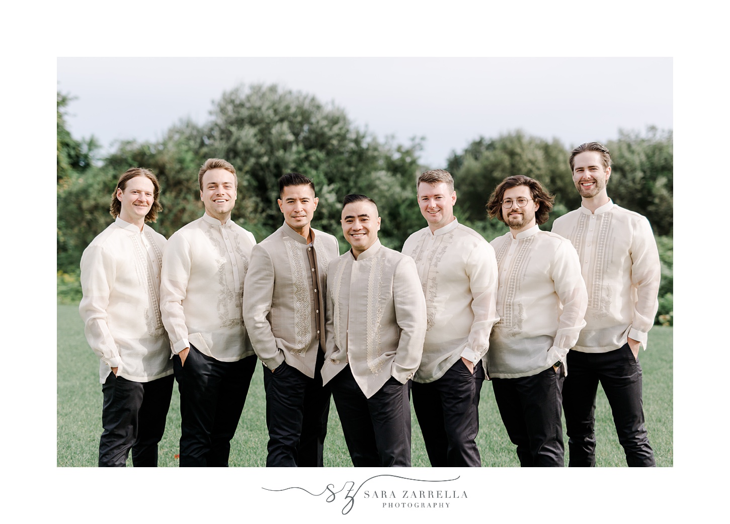 groom poses with six groomsmen in barong style shirts at the Atlantic Wyndham Resort