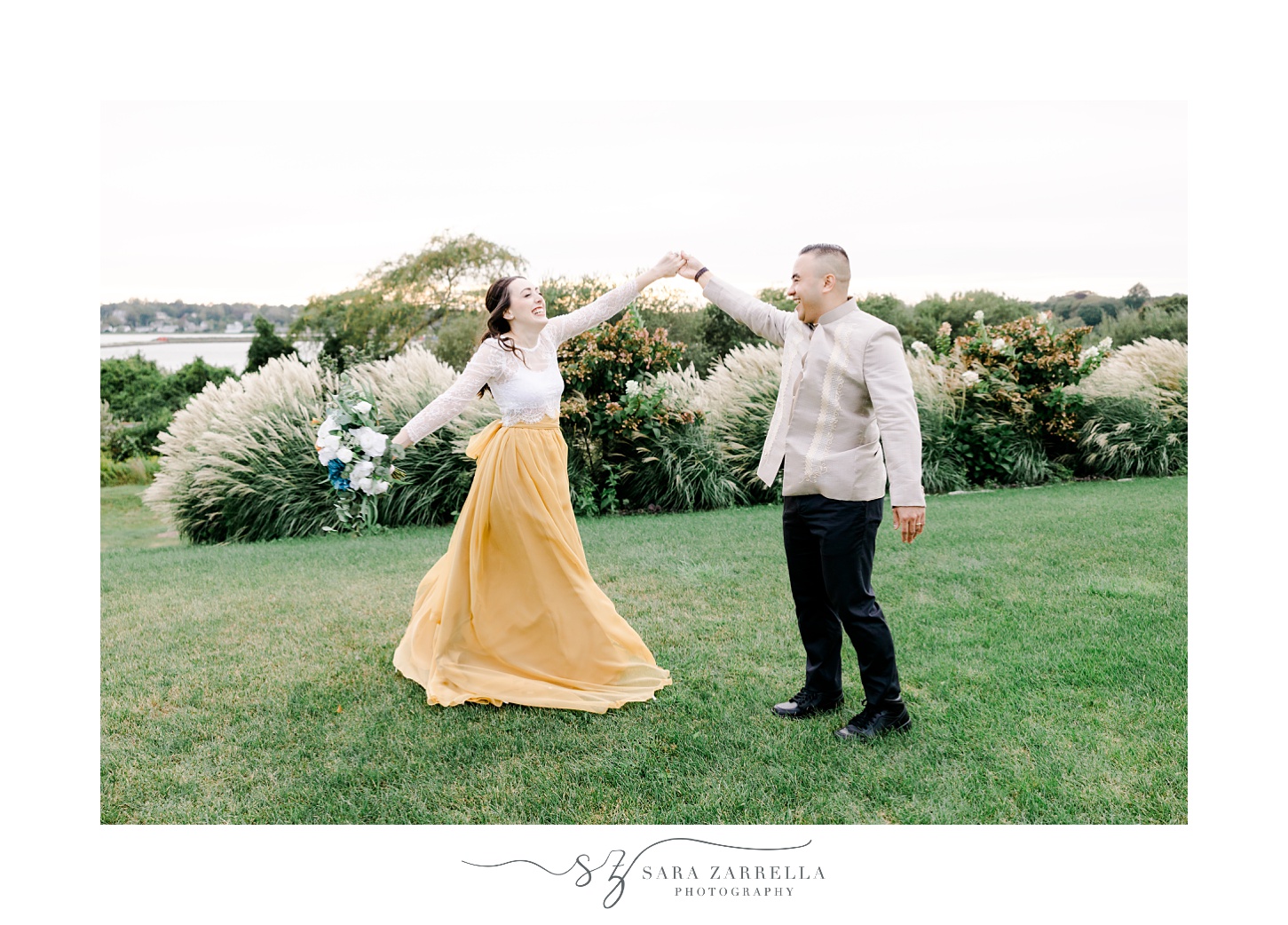 groom twirls bride under arm at the Atlantic Wyndham Resort