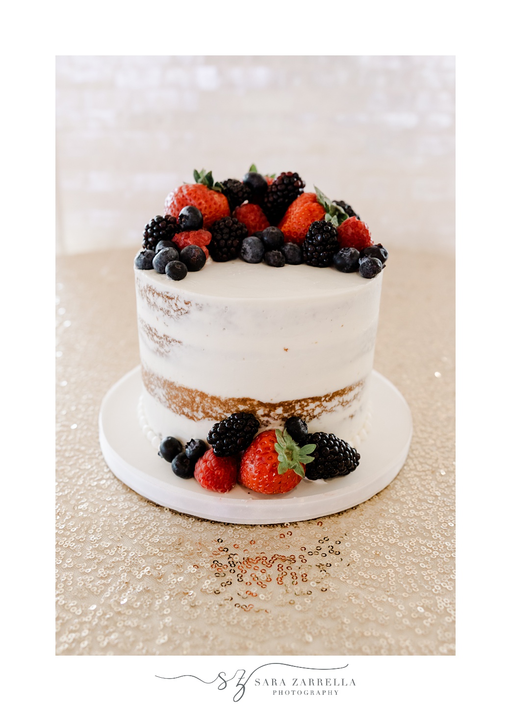cutting cake with berries on top at the Atlantic Wyndham Resort