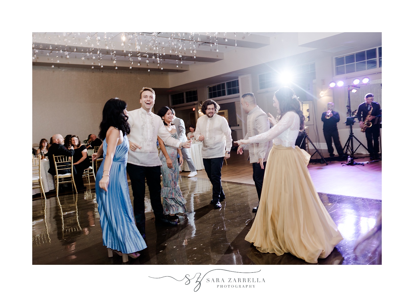 newlyweds dance with guests during Rhode Island wedding reception 