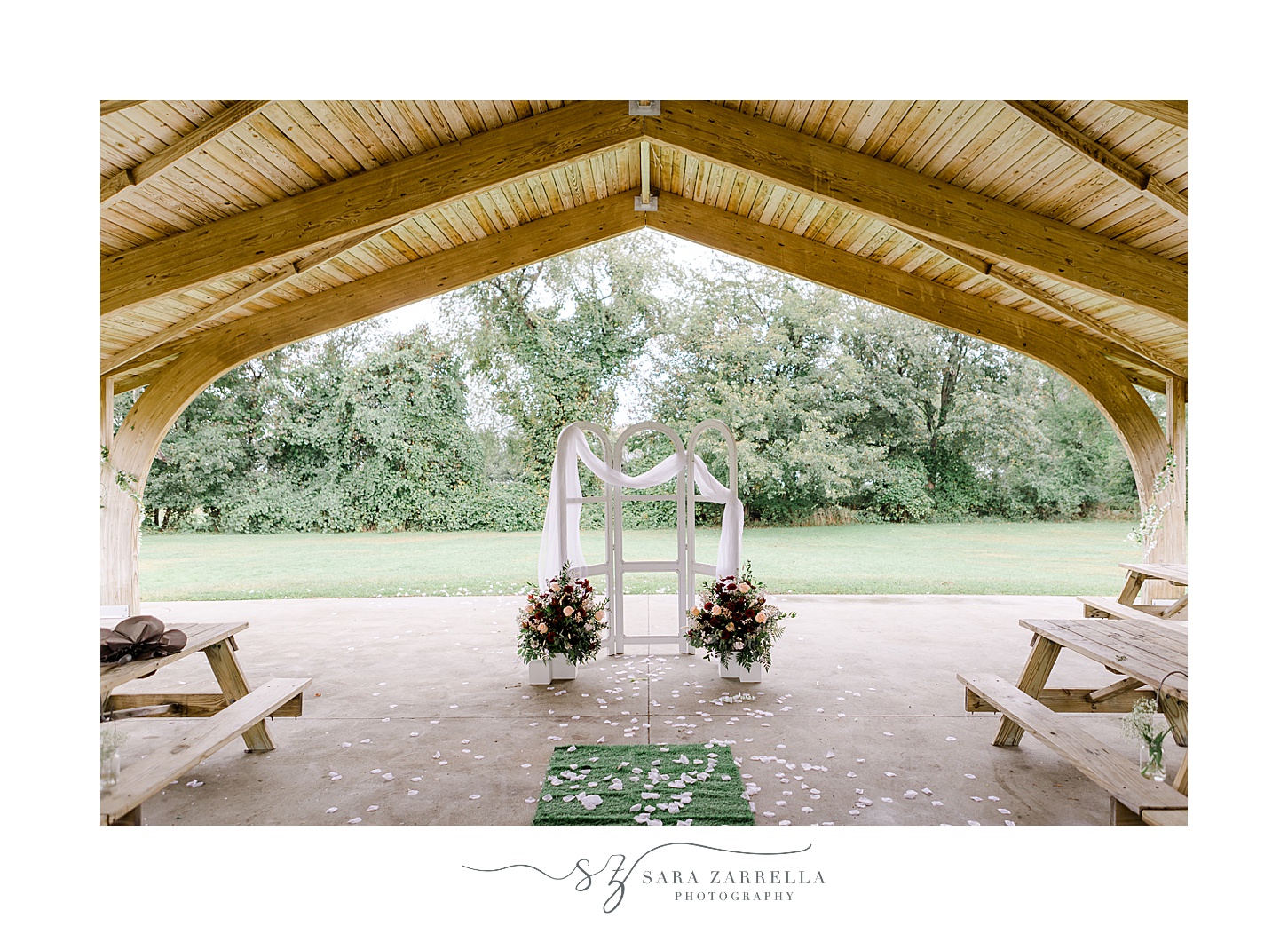 arbor with white linen and florals at Colt State Park