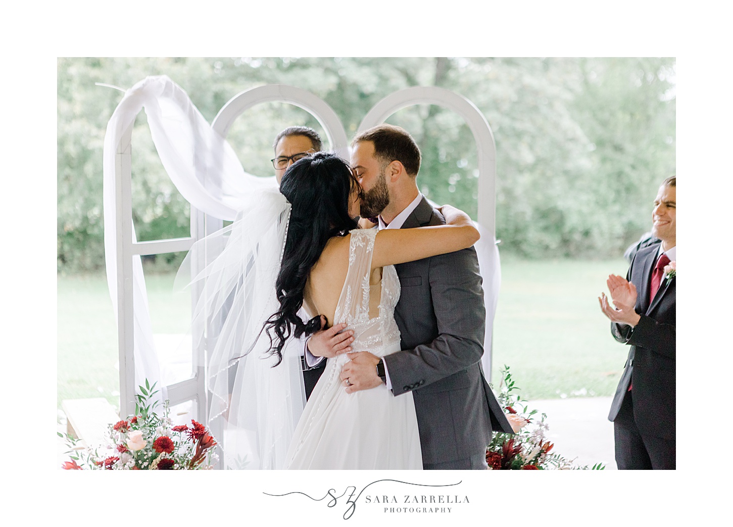 bride and groom kiss during ceremony at the Chapel by the Sea in Colt State Park