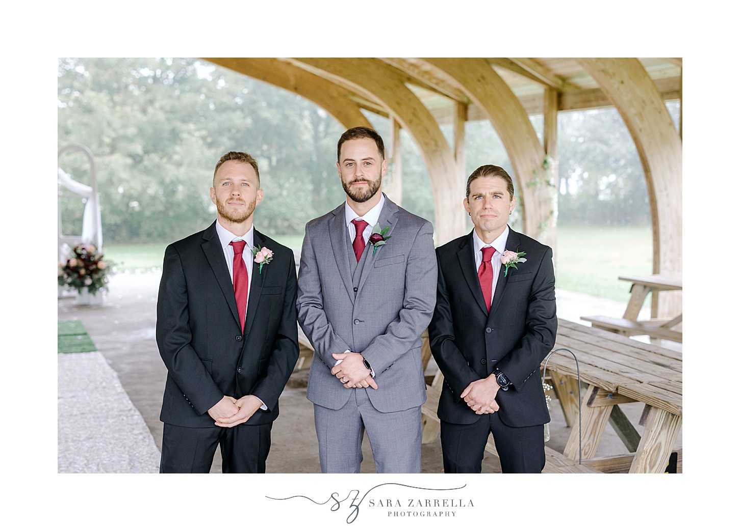 groom stands with groomsmen inside Colt State Park