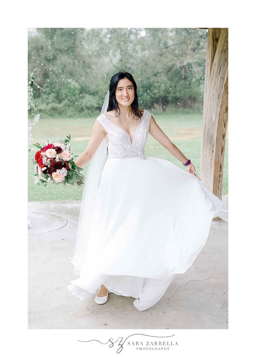 bride twirls during portraits under patio awning at Colt State Park