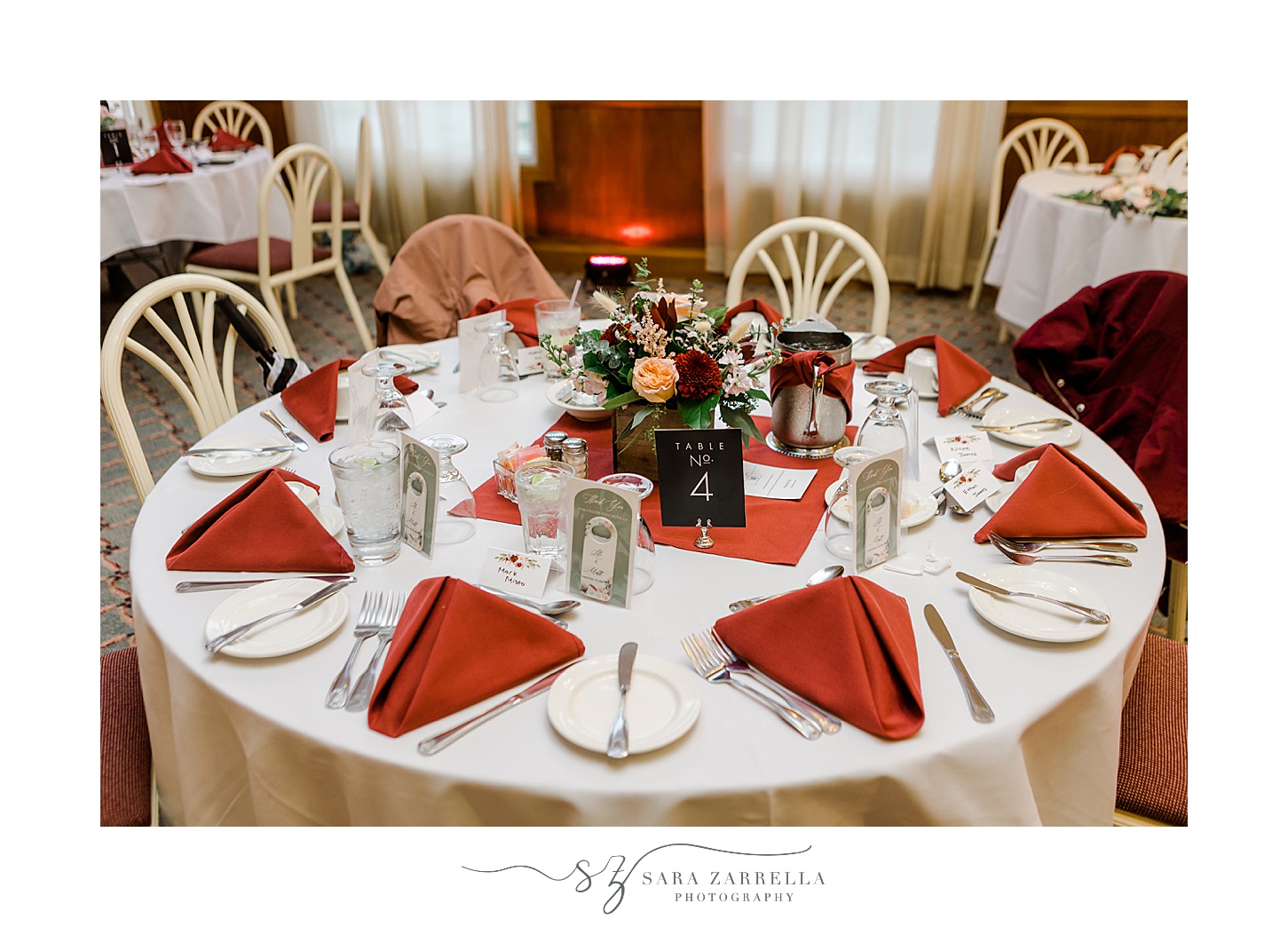 wedding reception with red accents and pink flowers at Jacky's Galaxie