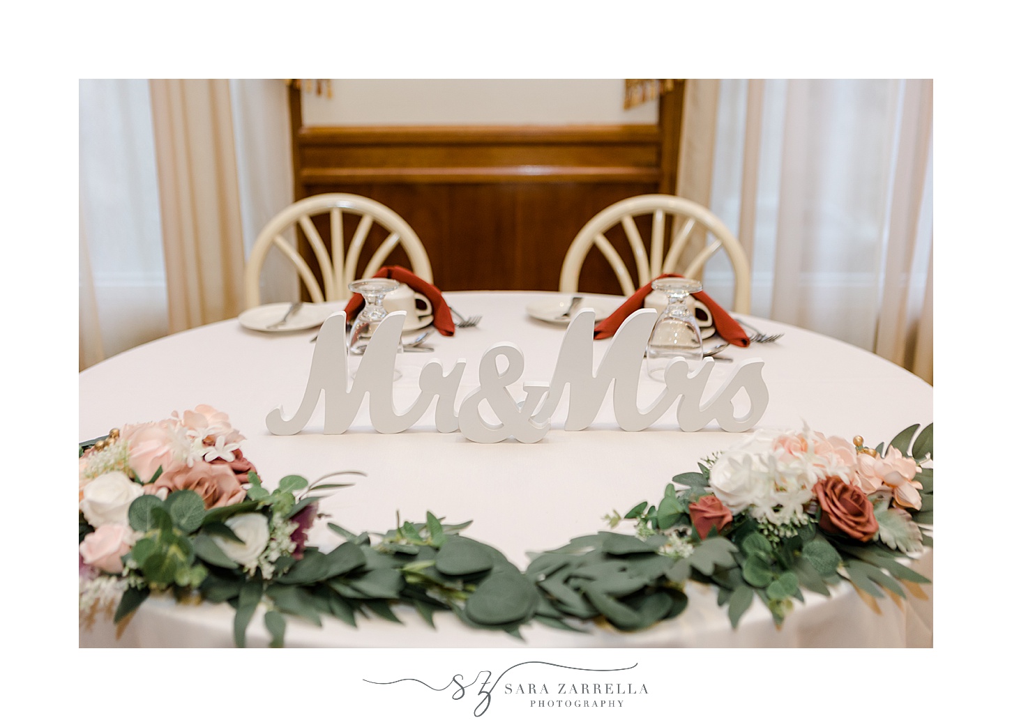 Mr and Mrs sign sits on sweetheart table inside Jacky's Galaxie