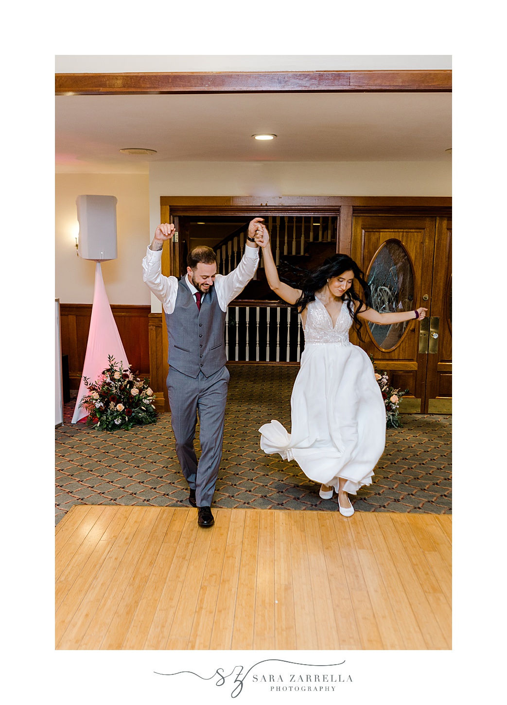 newlyweds cheer and dance walking though Jacky's Galaxie