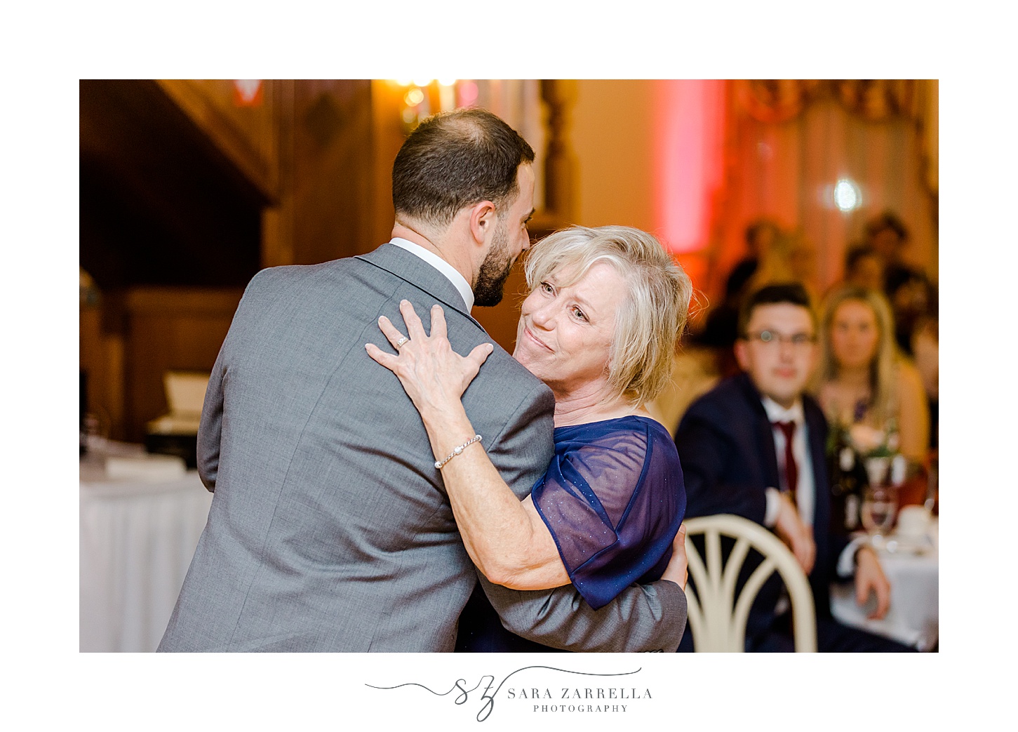 groom hugs mom during dance inside Jacky's Galaxie