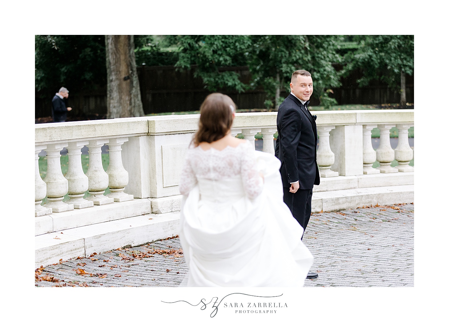bride walks to meet groom for first look at Rosecliff Mansion
