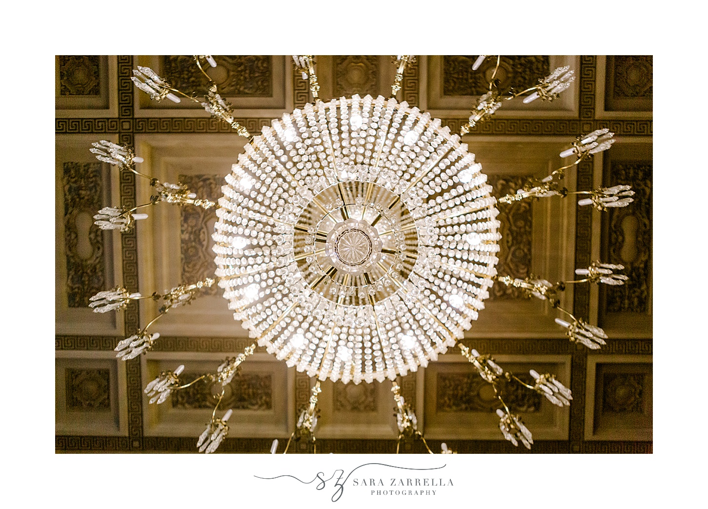 diamond chandelier hanging from ceiling inside Rosecliff Mansion