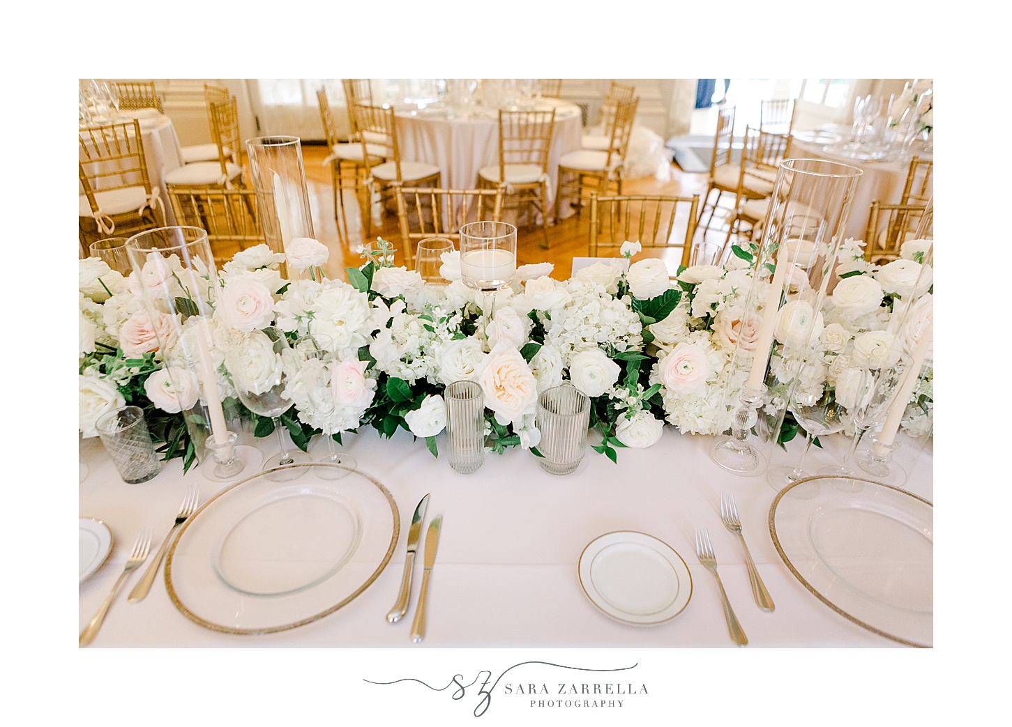 wedding reception with ivory and pale pink flowers at Rosecliff Mansion
