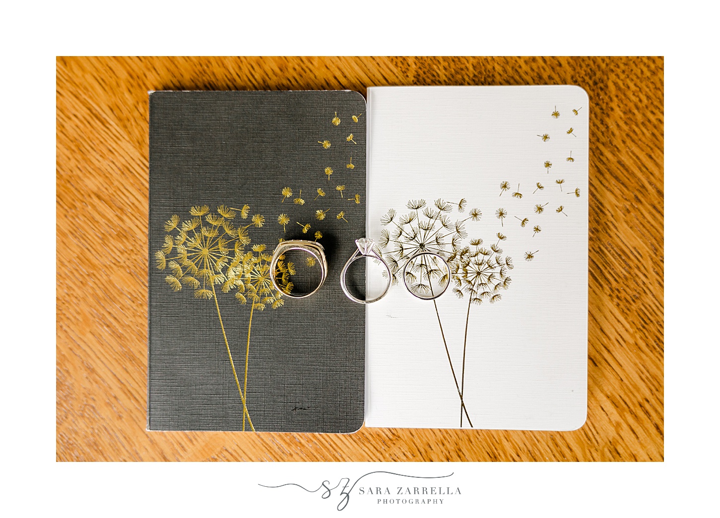 black and white vow booklets with gold dandelions on front