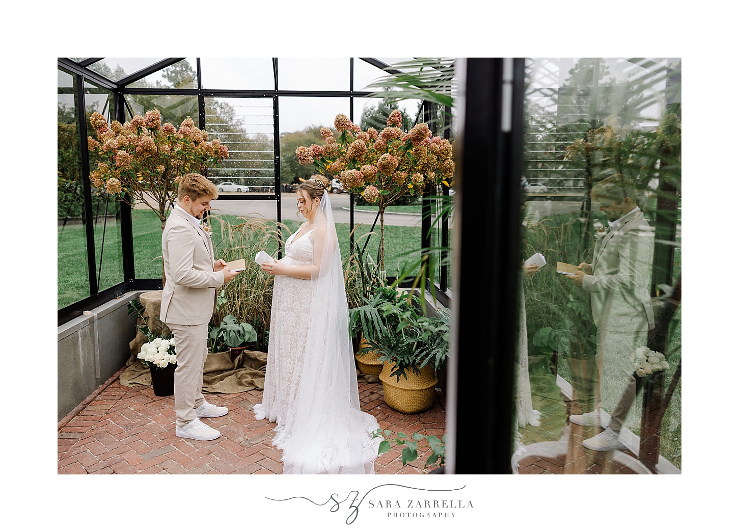 bride and groom exchange private vows in greenhouse in Rhode Island