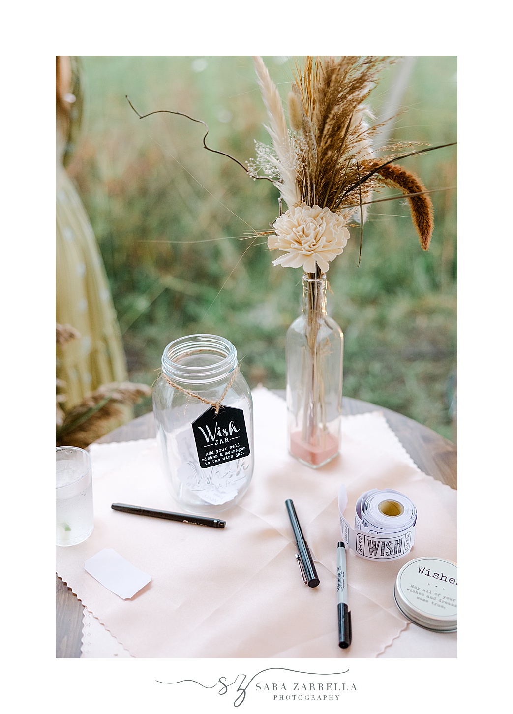 guest book with polaroid camera for reception on lawn of Rhode Island private residence
